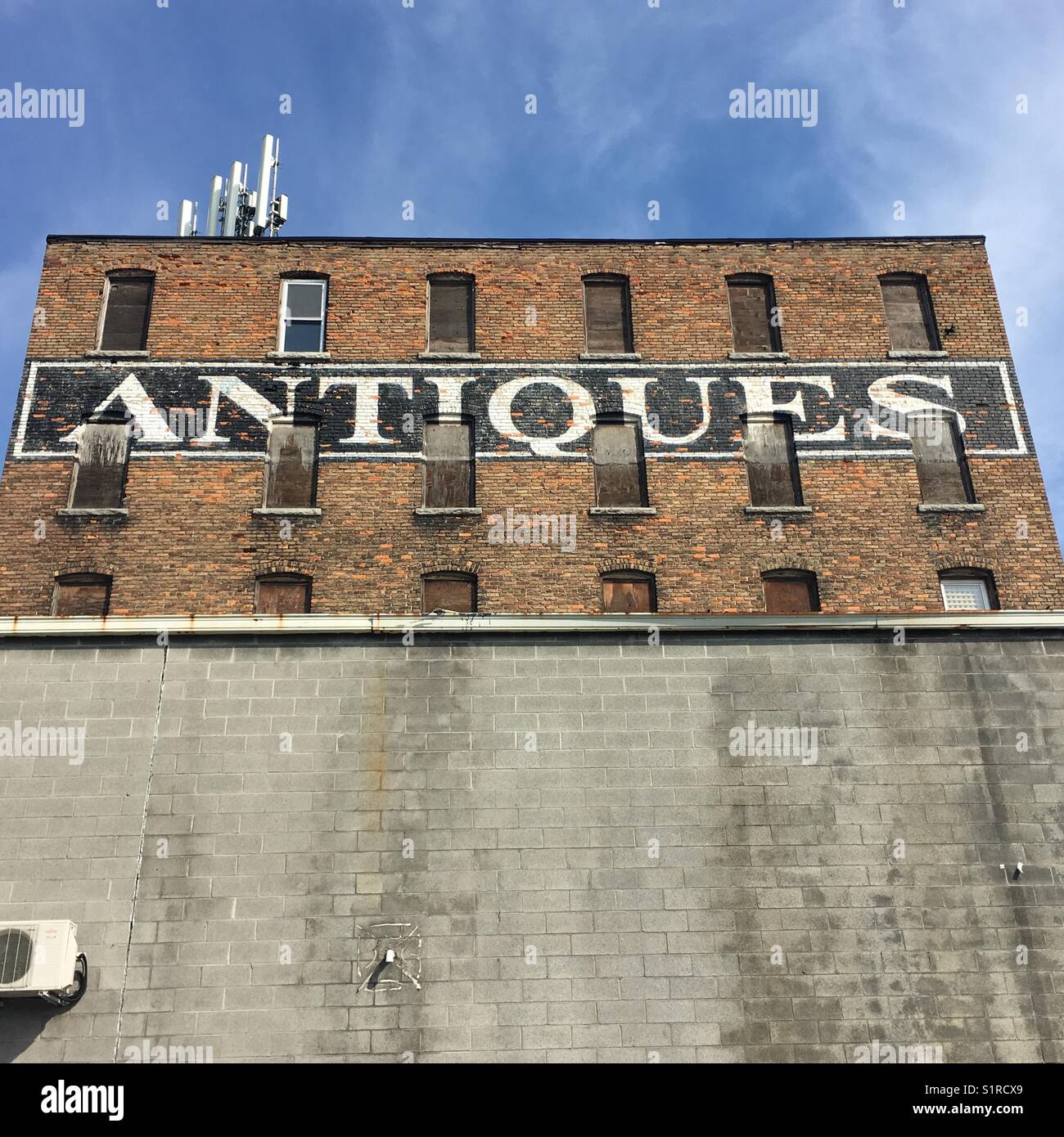 Antiques sign on the side of building. Syracuse New York State USA - Smartphone Captured Stock Image Antiques sign on the side of building. Syracuse New York State USA - Smartphone Captured Stock Image
