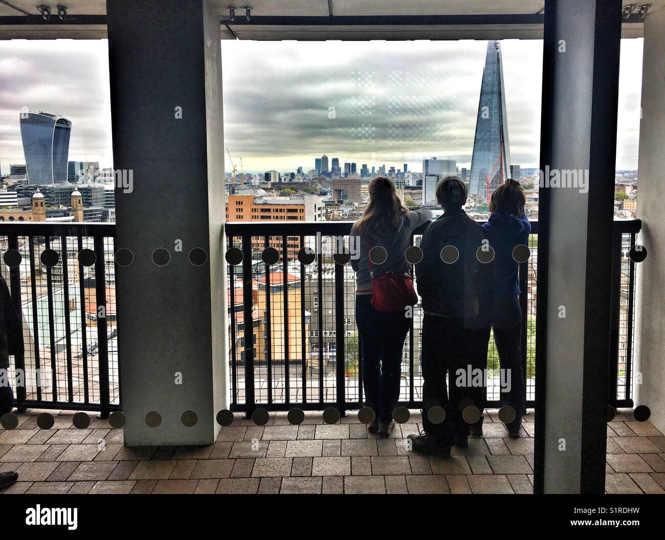 Children looking out at view of London - Smartphone Captured Stock Image