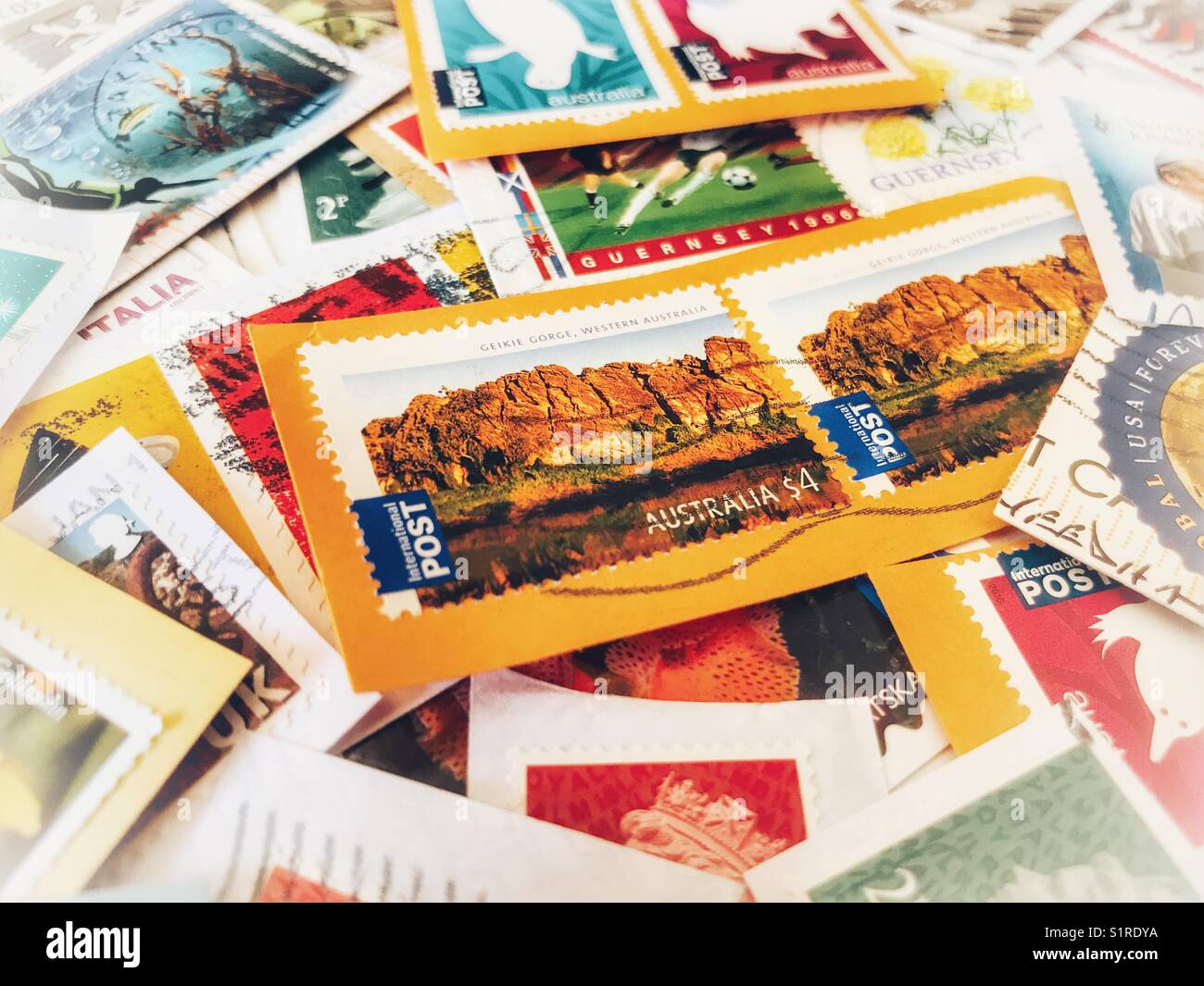 Stamp collection, unwashed stamps - Smartphone Captured Stock Image