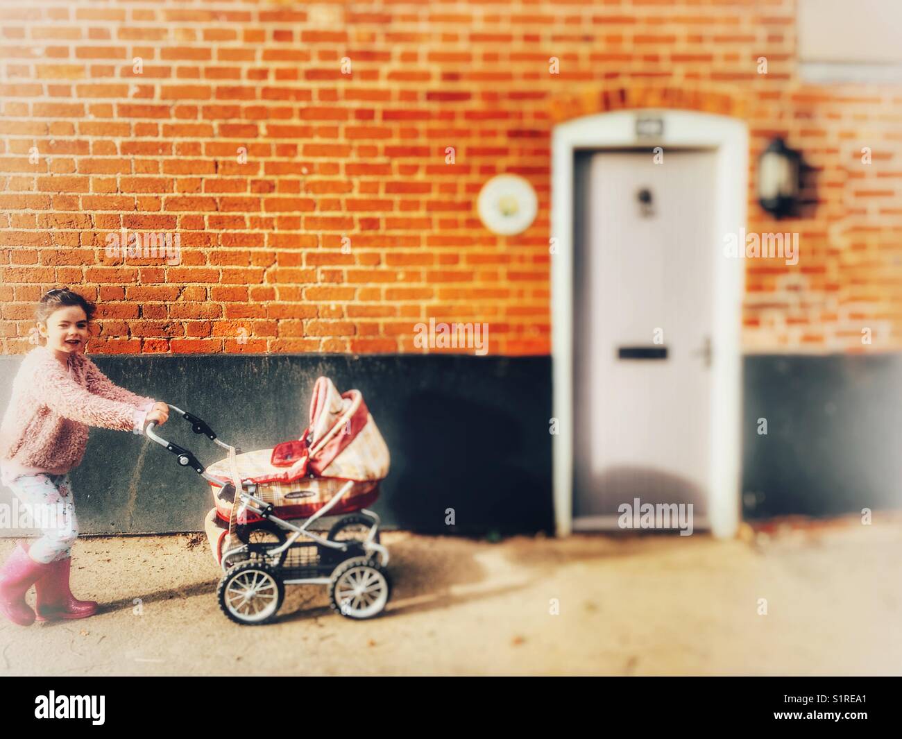 Girl pushing pram - Smartphone Captured Stock Image
