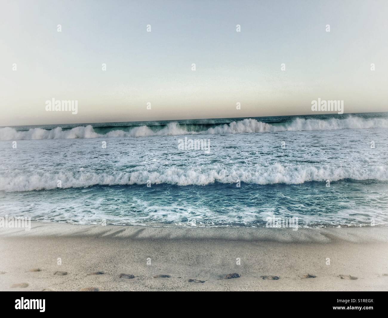 The waves rolling in. - Smartphone Captured Stock Image