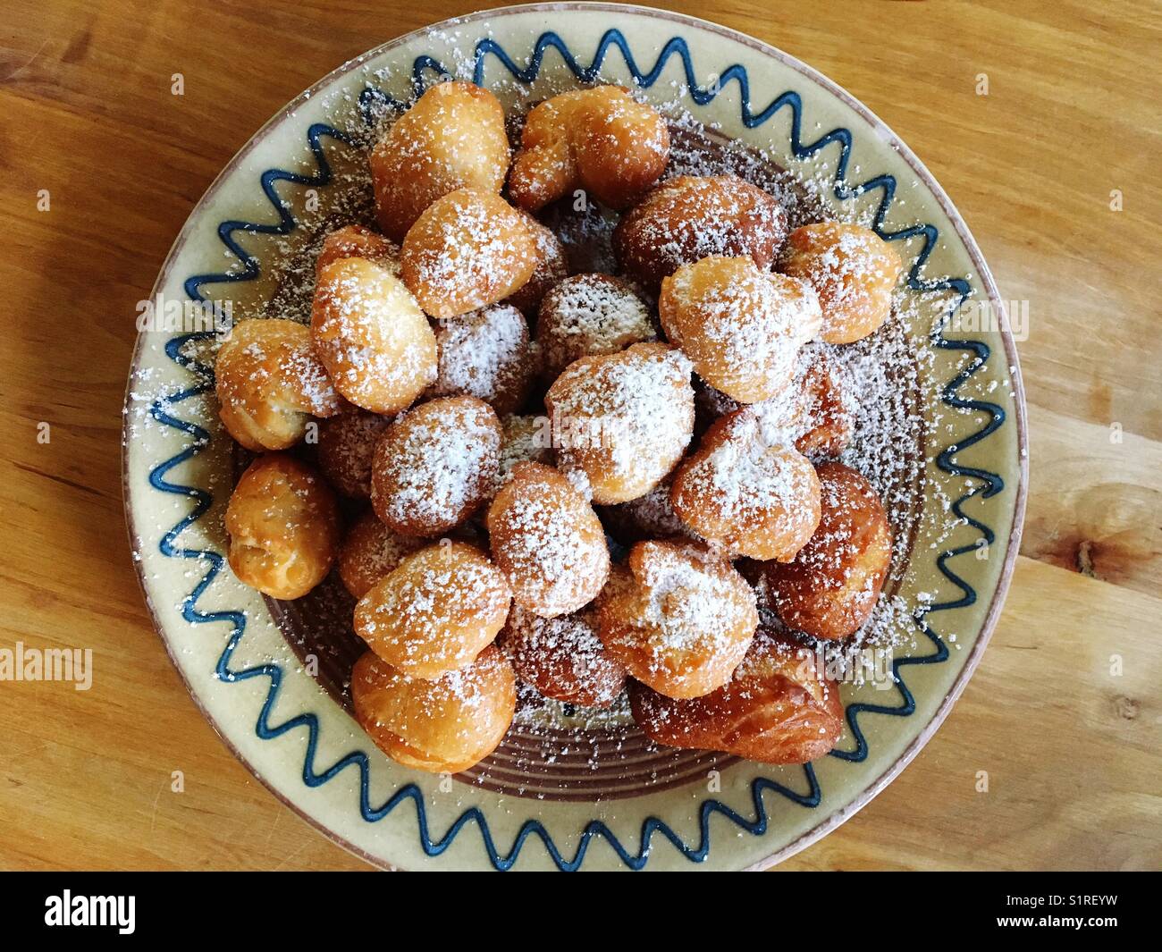 German fried yeast dough pieces called schmalzkuchen - Smartphone Captured Stock Image