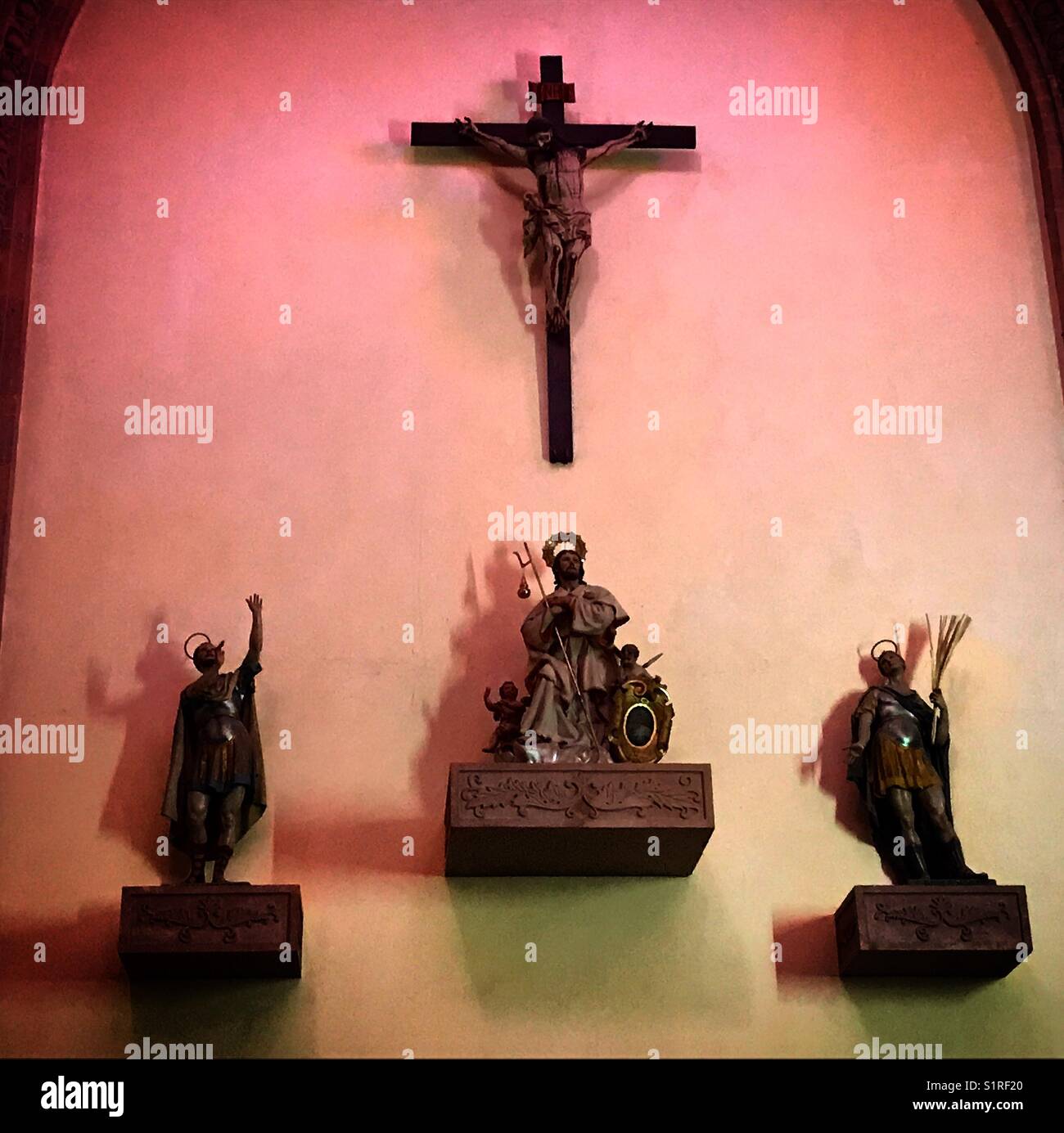 Images of Jesus Christ crucified, Saint James Apostle (c) and other Saints decorate an altar in Queretaro, Mexico - Smartphone Captured Stock Image