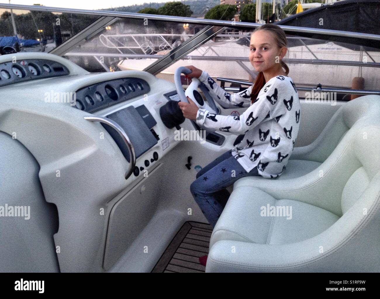 Driving a yacht hires stock photography and images Alamy