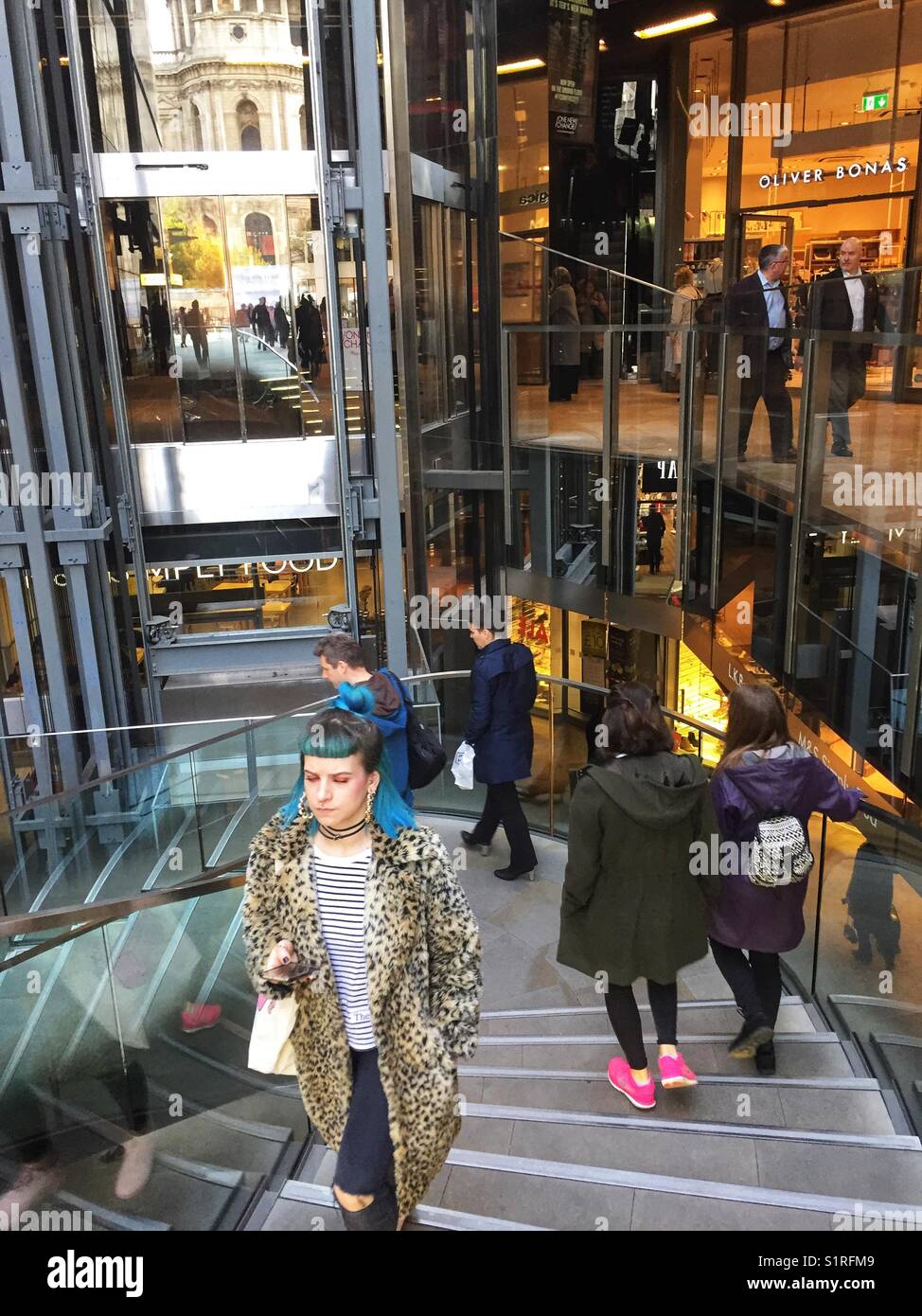 Shoppers at 1, New Change owned by Land Securities in London, England on October 30 2017 - Smartphone Captured Stock Image