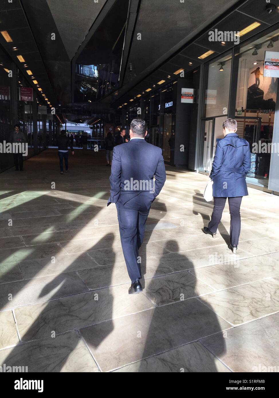 Smartly dressed men walk through 1, New Change owned by Land Securities in London, England on October 30 2017 Stock Photo
