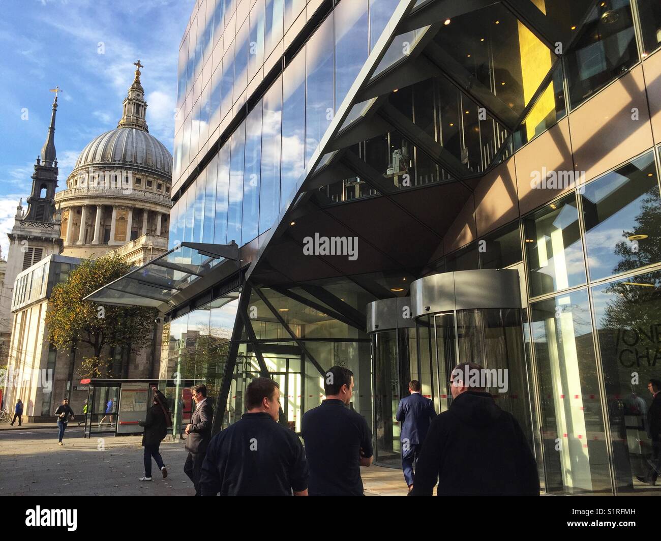 People stand outside 1, New Change shopping centre owned by Land Securities in London, England on October 30 2017 Stock Photo