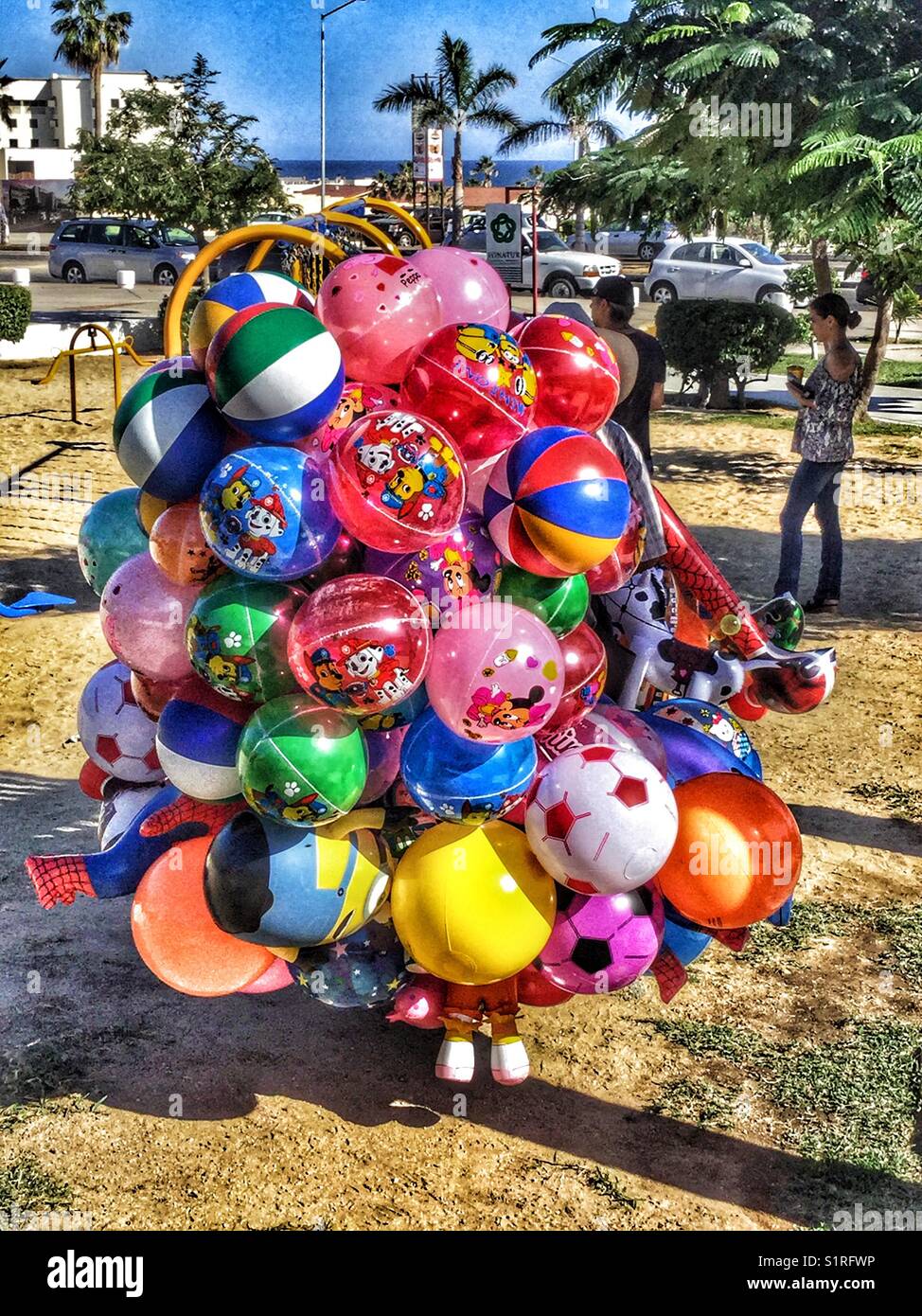 Street vendor selling colourful balloons at a public park in San Jose del Cabo. - Smartphone Captured Stock Image