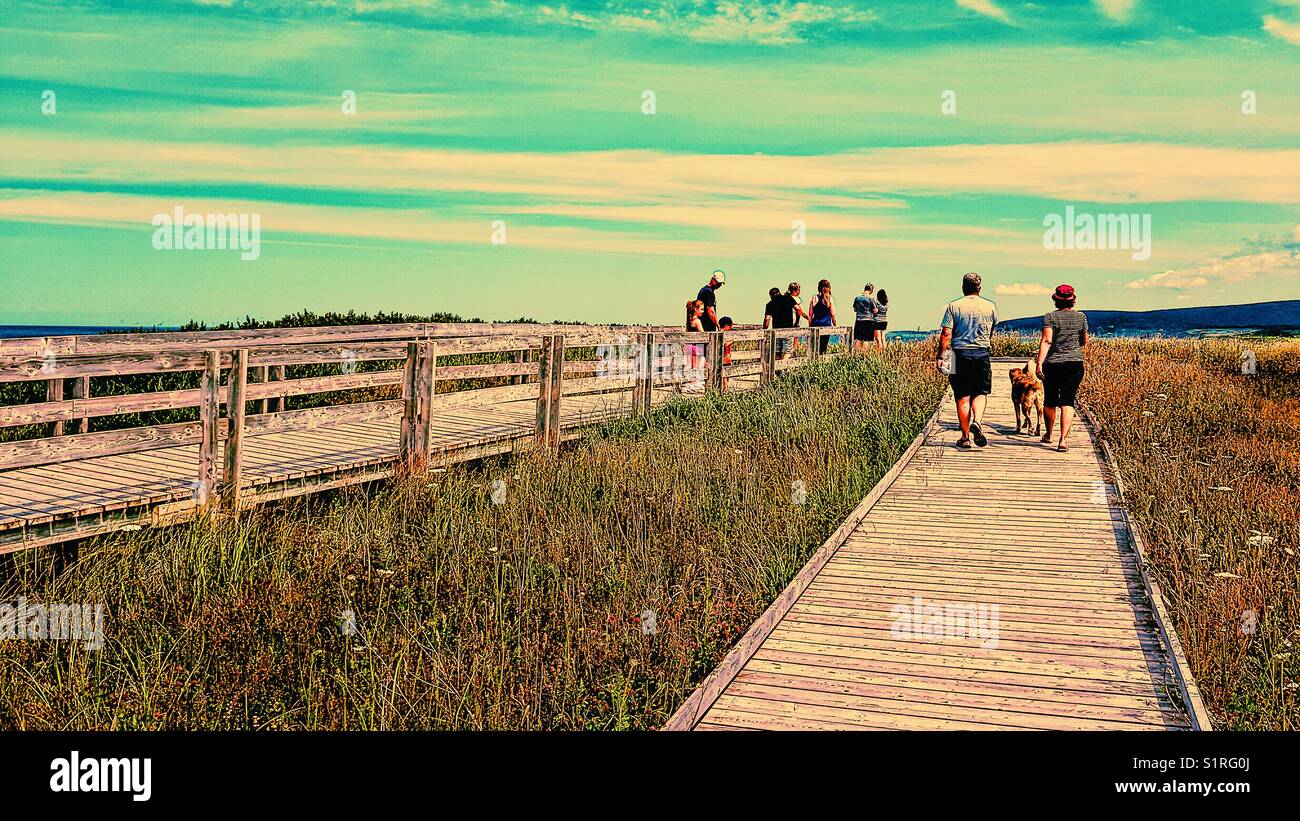 People on boardwalk, Inverness, Cape Breton Island, Nova Scotia, Canada - Smartphone Captured Stock Image