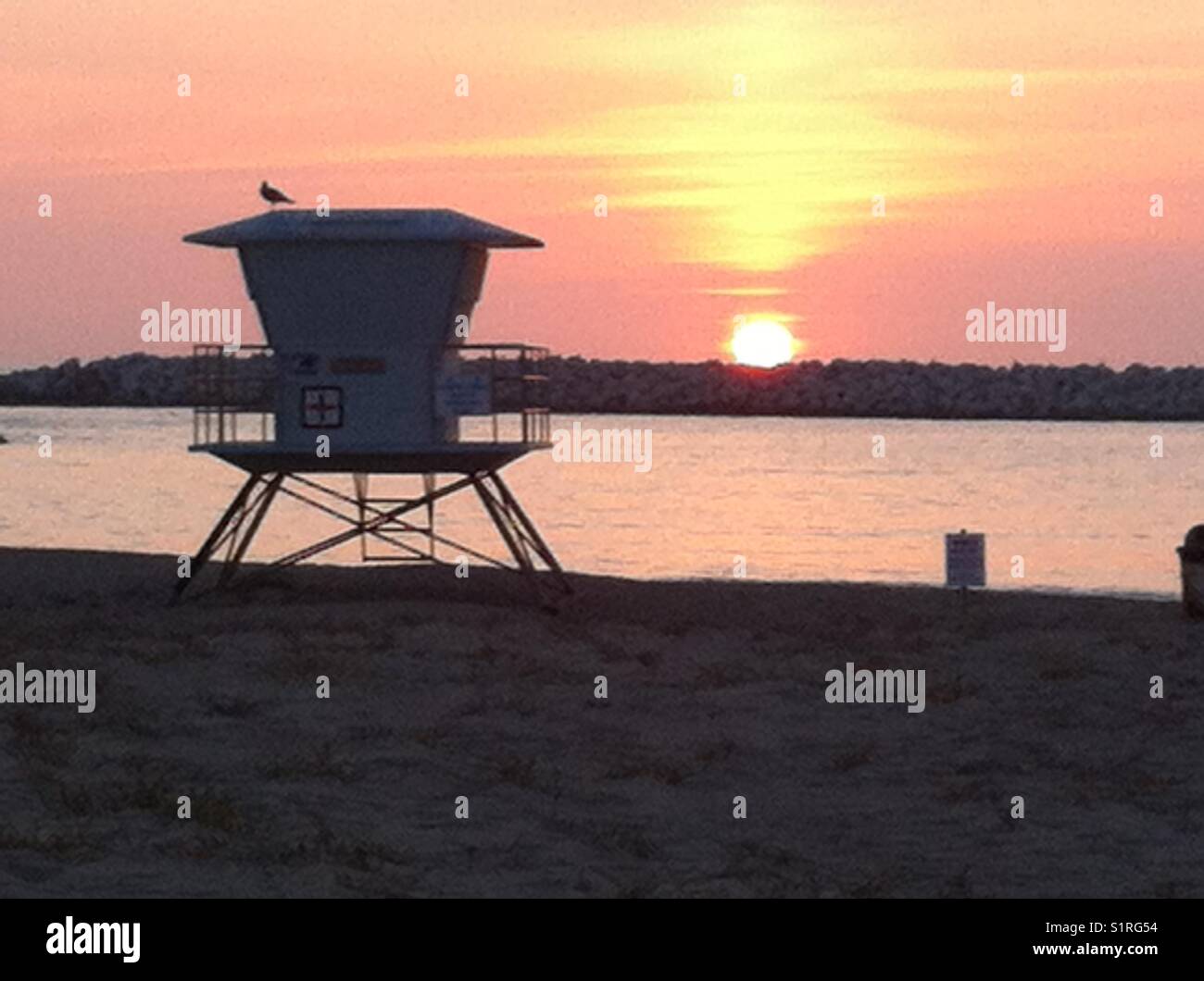 Sunset over rocks Stock Photo - Alamy