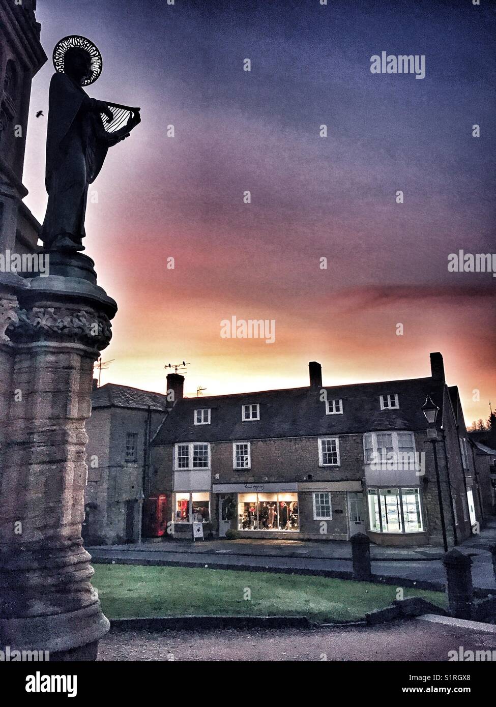 Digby Memorial silhouette and street scene at dawn, Sherborne, Dorset, England - Smartphone Captured Stock Image