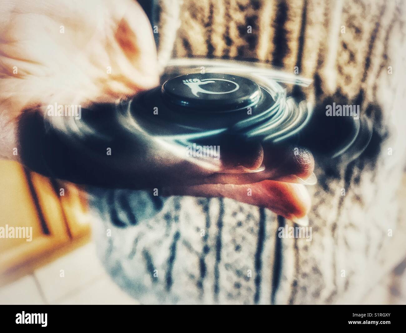 Fidget spinner, spinning - Smartphone Captured Stock Image