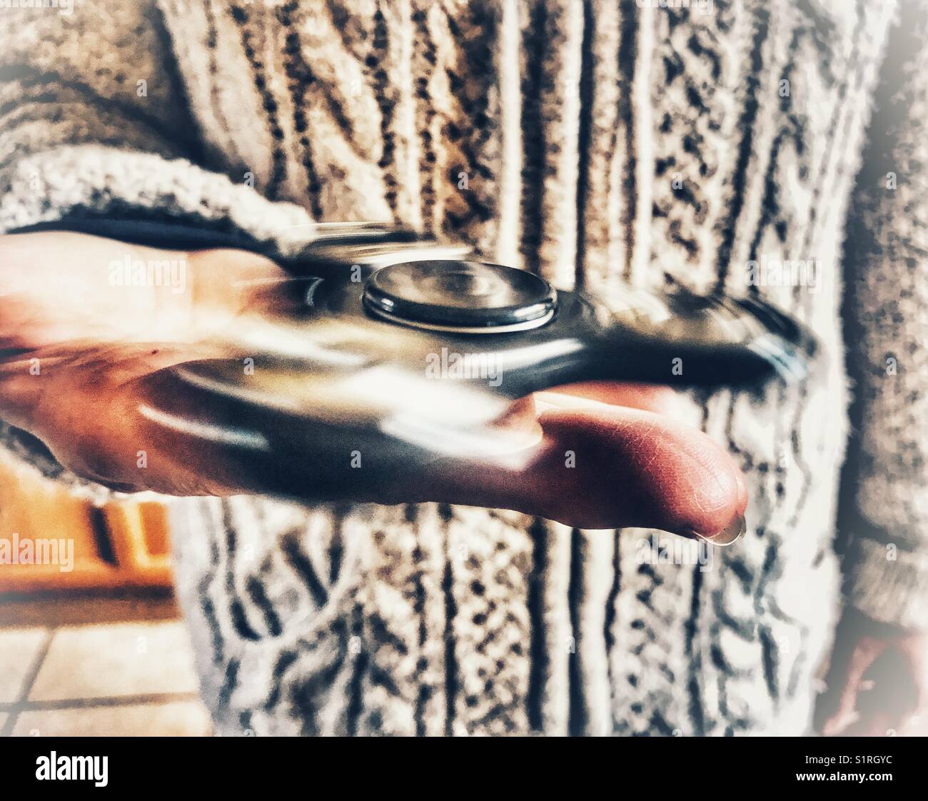 Fidget spinner, spinning - Smartphone Captured Stock Image