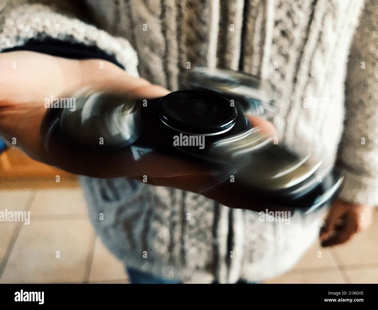 Fidget spinner, high angle view Stock Photo