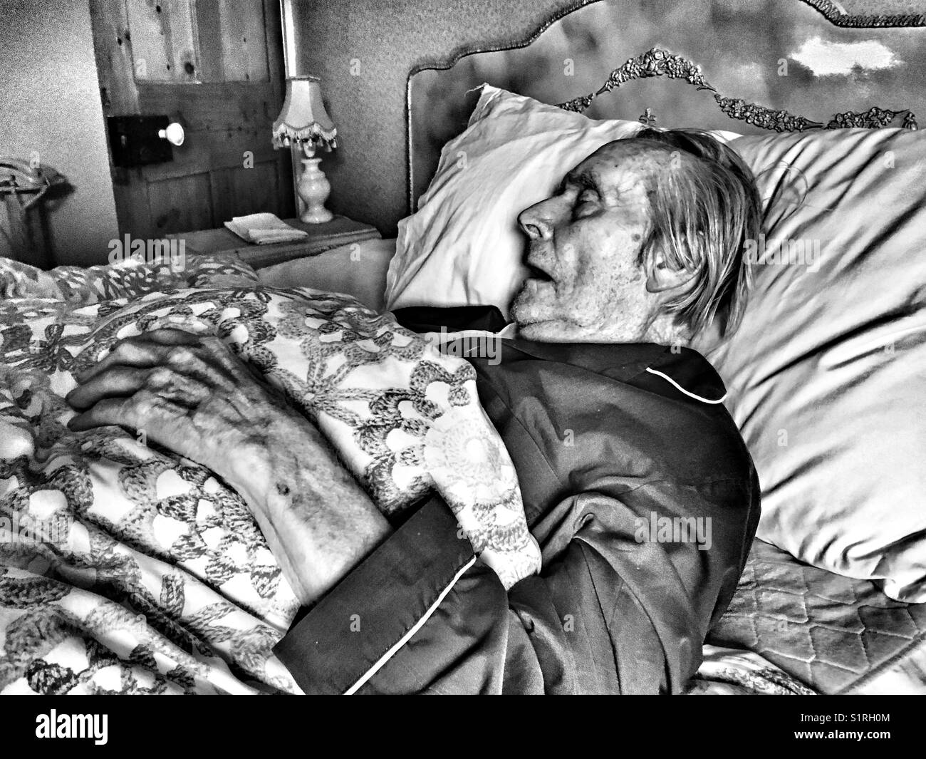 Elderly British man asleep in bed - Smartphone Captured Stock Image