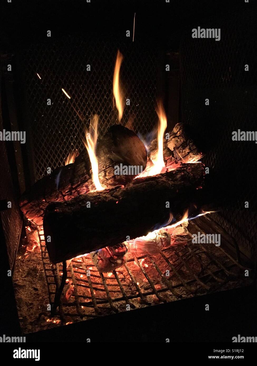 Burning campfire; warm and cozy - Smartphone Captured Stock Image