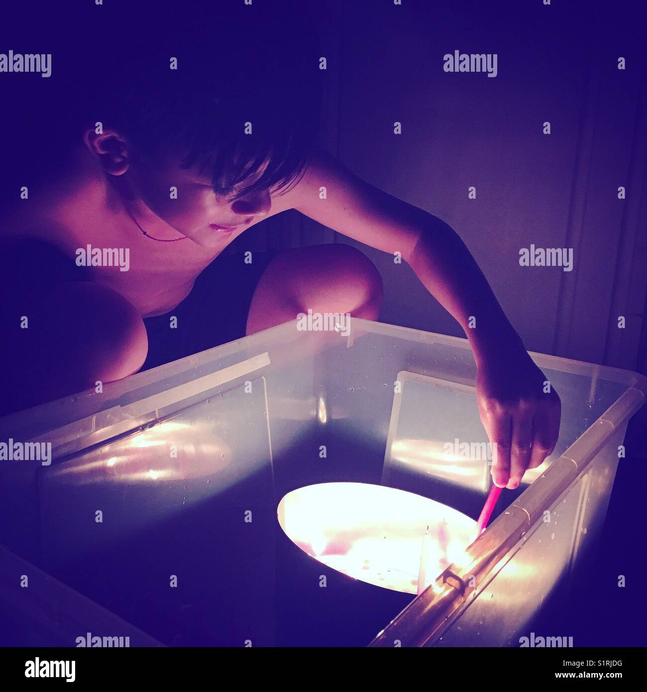 Boy playing with fire during Lantern Festival in Hong Kong - Smartphone Captured Stock Image