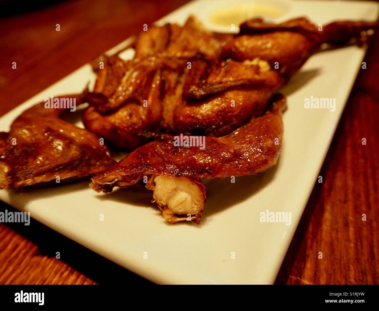 Deep fried quail on a plate Stock Photo Alamy