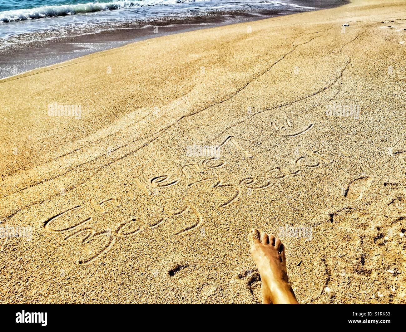 Chileno Bay Beach written in the sand, Mexico. - Smartphone Captured Stock Image