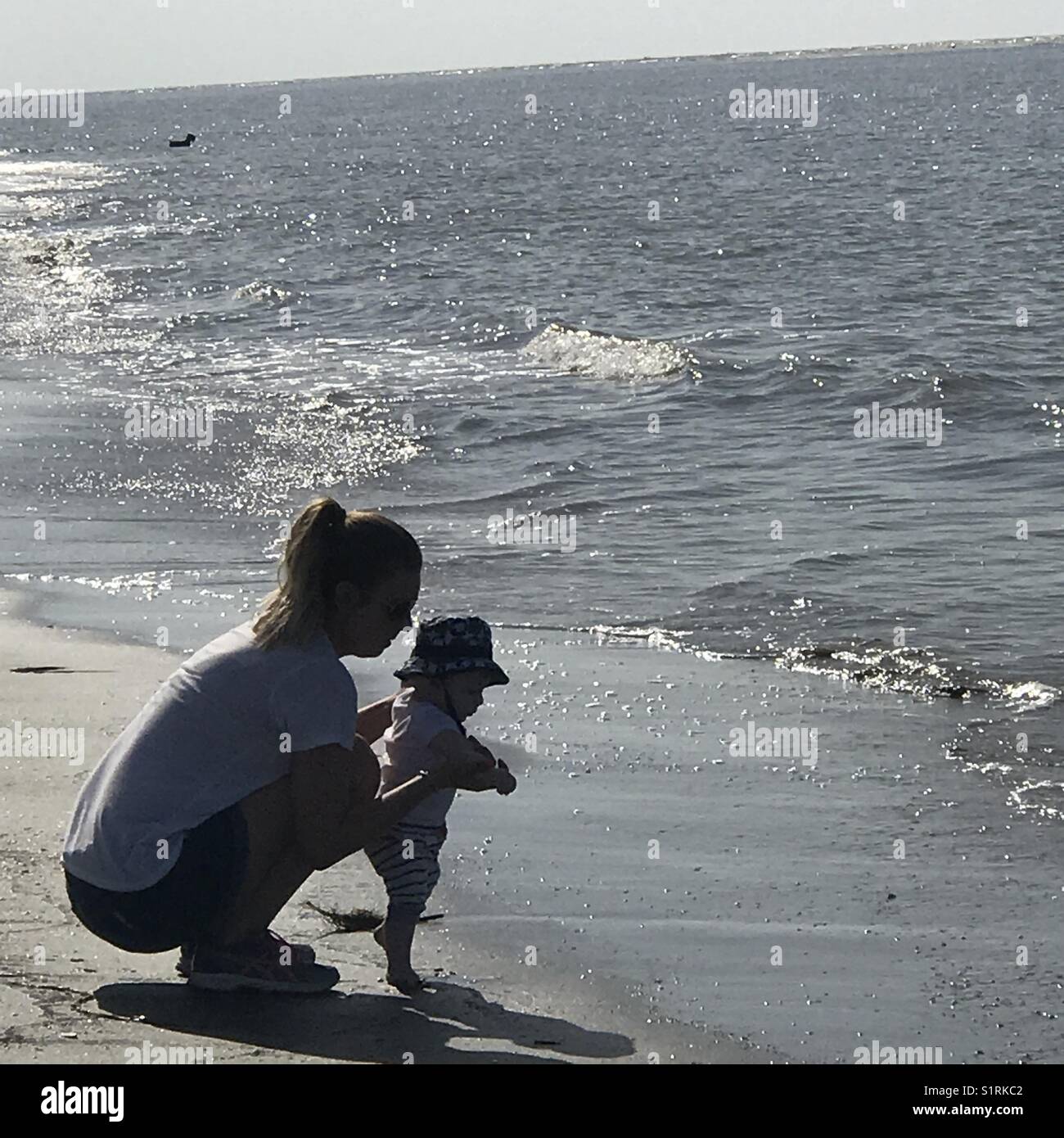 Mom and baby on beach Stock Photo Alamy