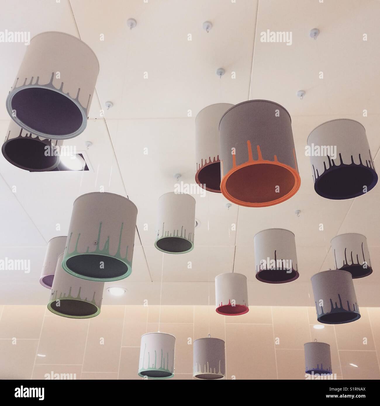 Paint cans for light fitting anyone Stock Photo Alamy
