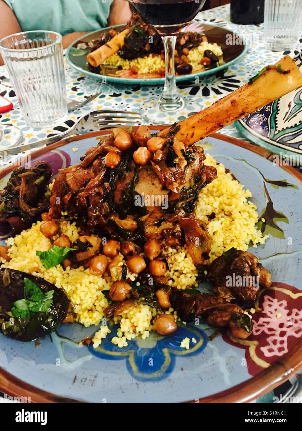 Traditional Moroccan lamb tajine served with couscous. Stock Photo