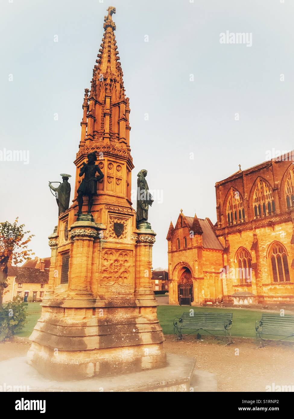 Digby Memorial and Sherborne Abbey, historic building, floodlit at dawn