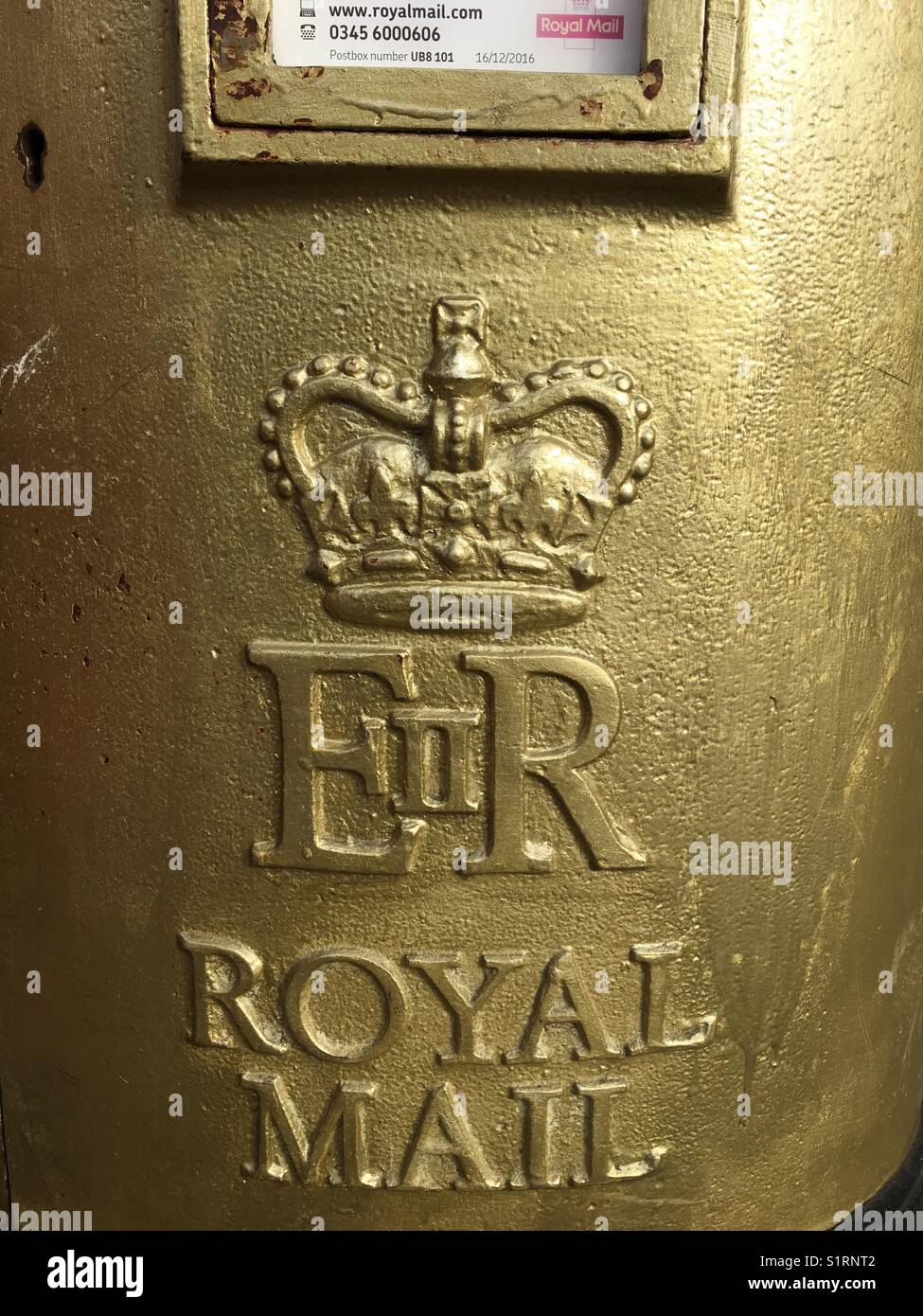 Golden postal pillar box Uxbridge Middlesex England - Smartphone Captured Stock Image