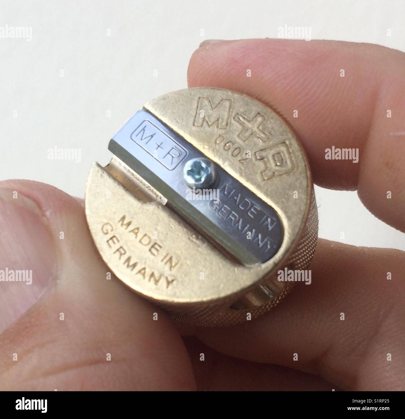 M+R brass pencil sharpener Stock Photo Alamy