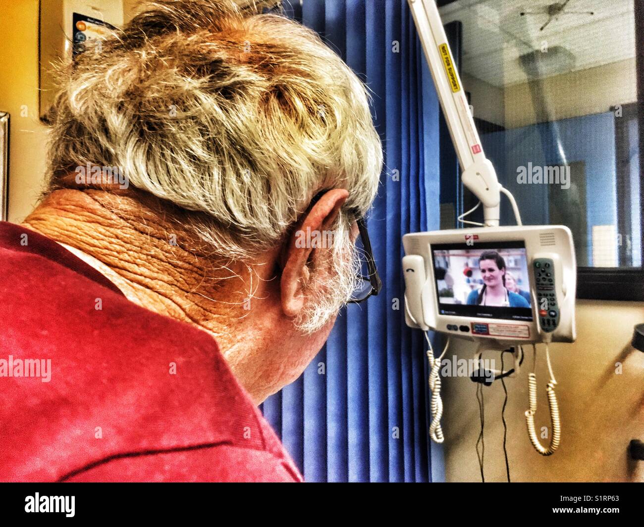 Hospital patient watching TV - Smartphone Captured Stock Image