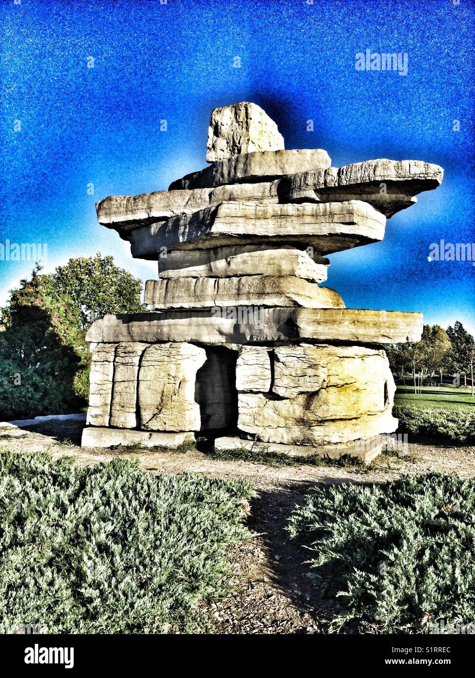 A large Inukshuk sculpture in a public park in Collingwood, Ontario. - Smartphone Captured Stock Image