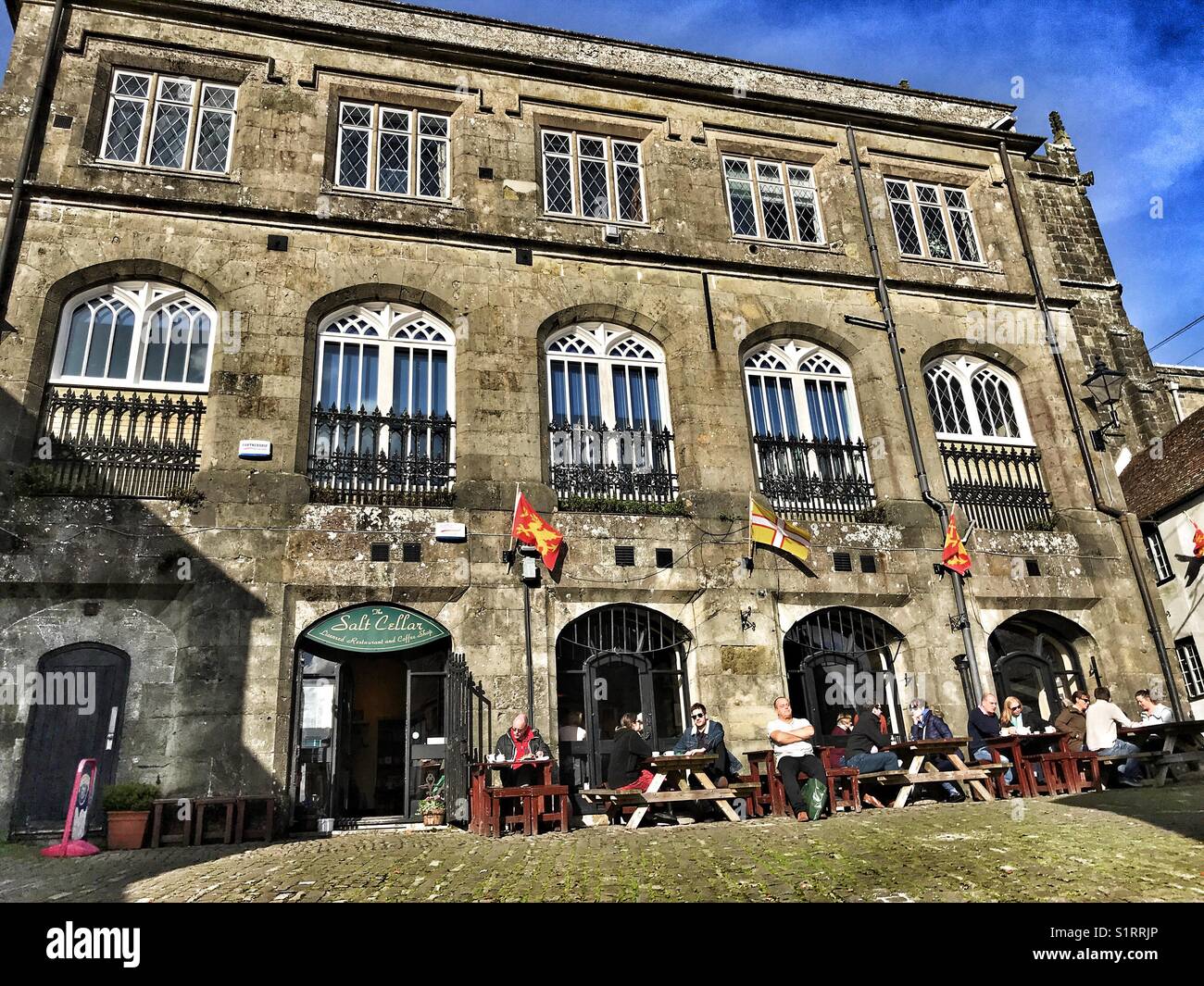 The Salt Cellar, Shaftesbury, Dorset, England, People seated outside admiring the famous view down Shaftesbury Gold Hill, location of the Hovis advert. - Smartphone Captured Stock Image