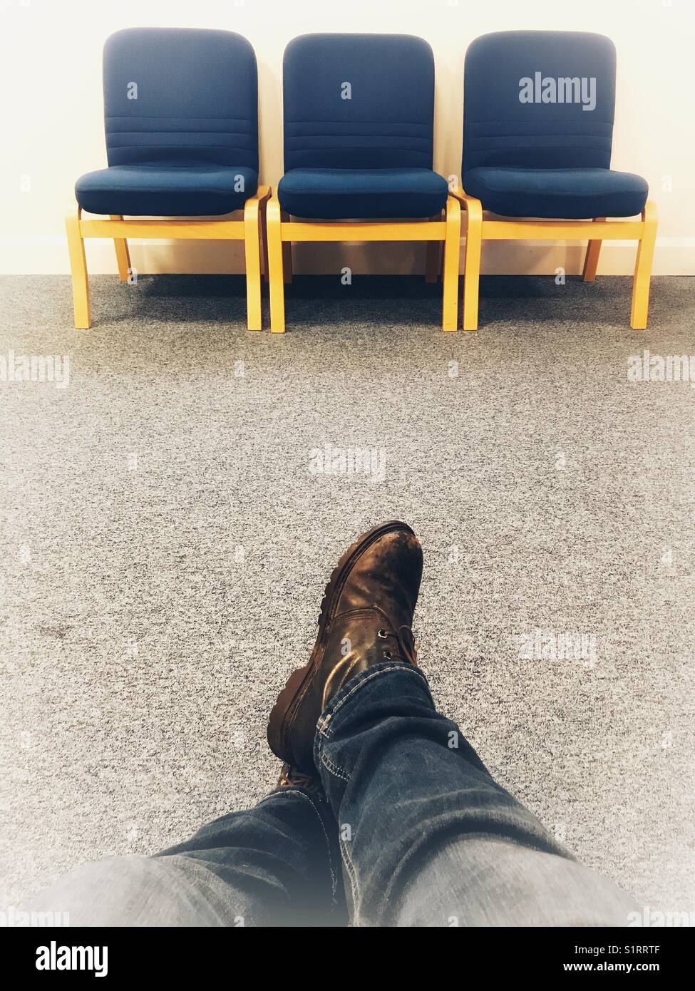 POV in the waiting room with three empty seats opposite - Smartphone Captured Stock Image