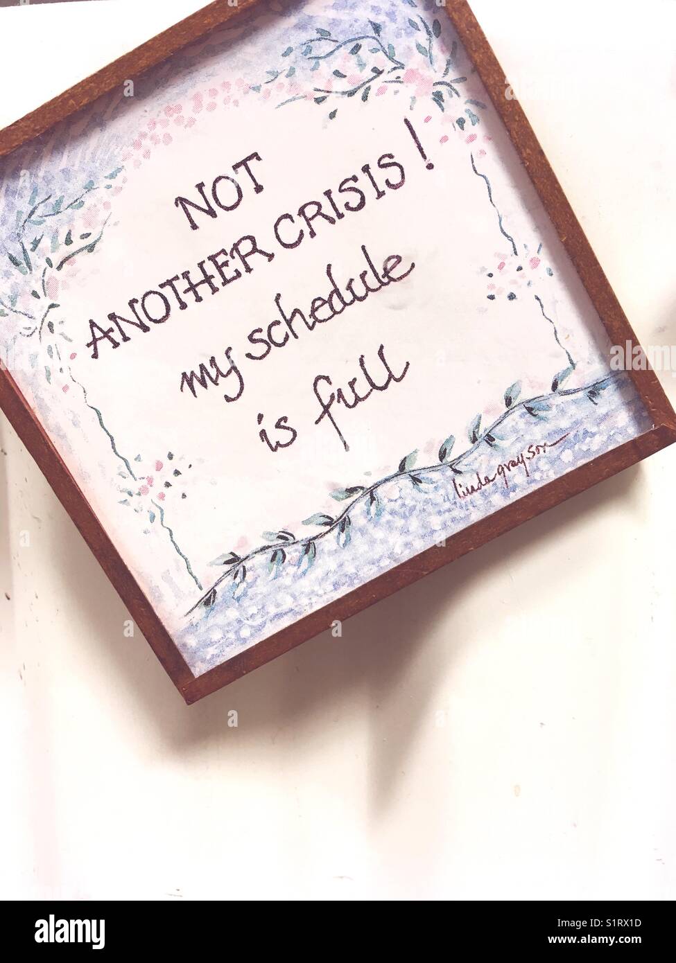 An inspirational Phrase about time management: Not another Crisis! My schedule is Full - Smartphone Captured Stock Image