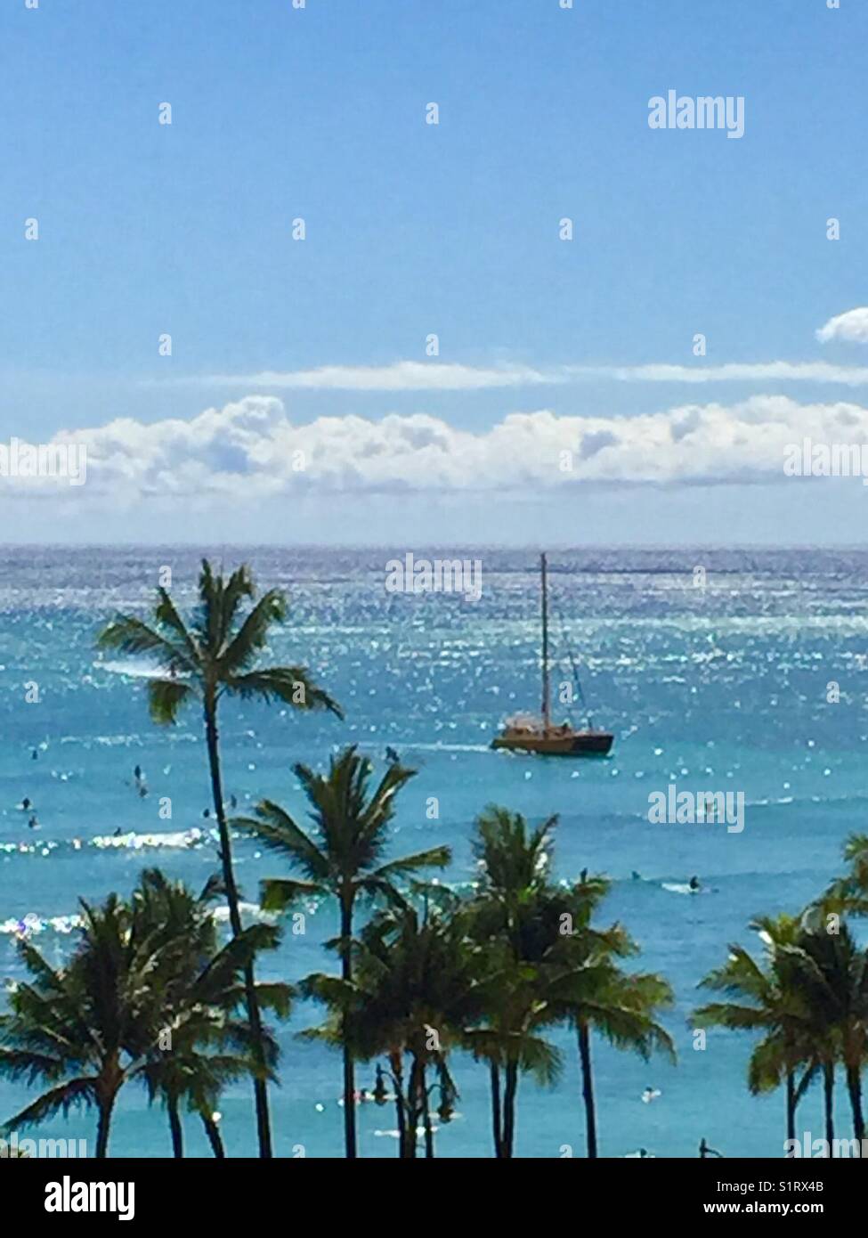 Boat sailing past Waikiki Beach, Hawaii Stock Photo Alamy