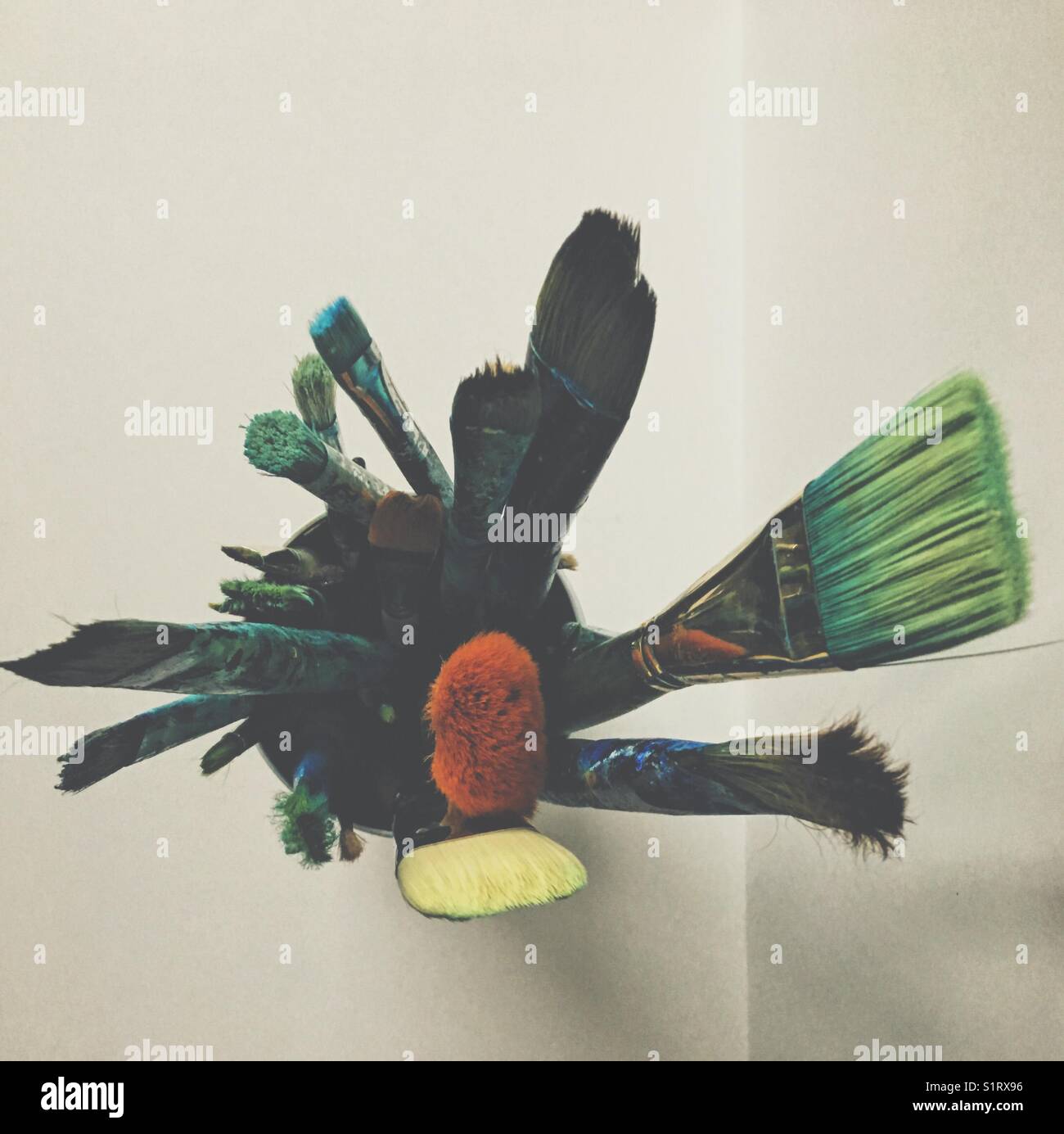 Paintbrushes in a can photographed from above. - Smartphone Captured Stock Image