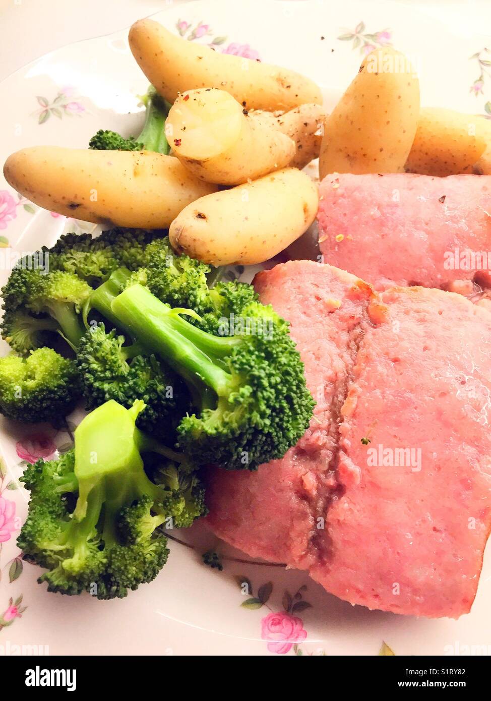 Main course meal of-polish sausage, fingerling potatoes and broccoli USA - Smartphone Captured Stock Image