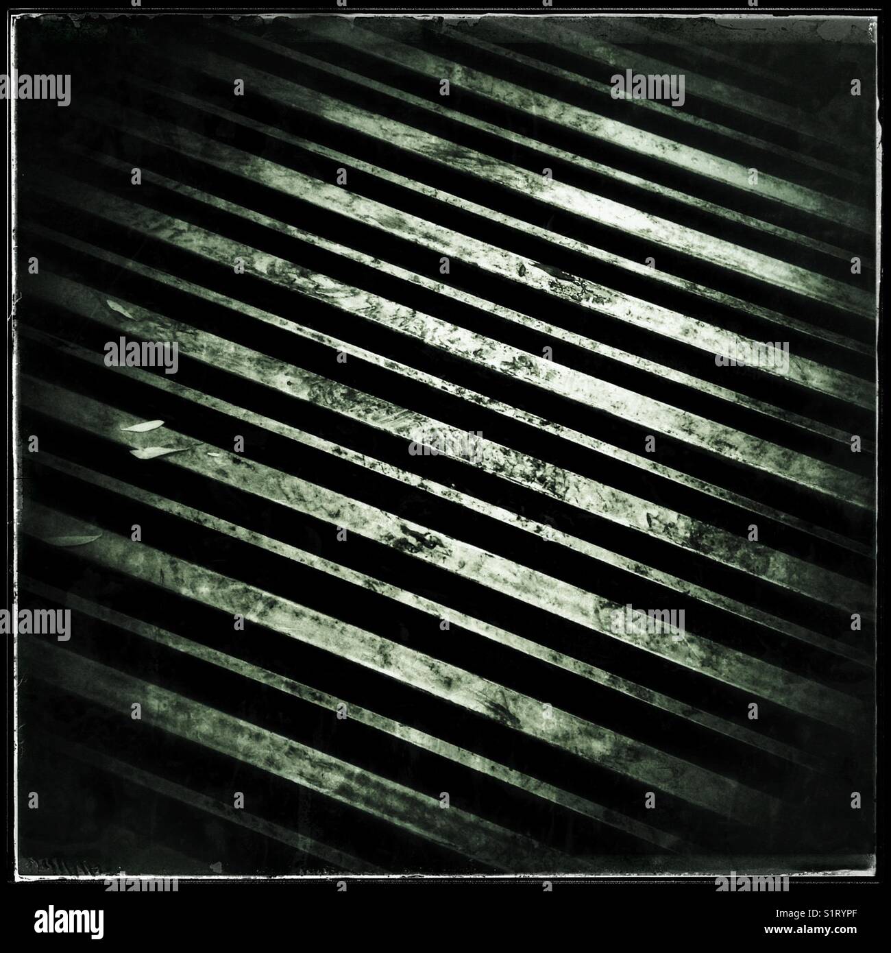 Pattern made by steel hopper at an olive mill, Catalonia, Spain. - Smartphone Captured Stock Image