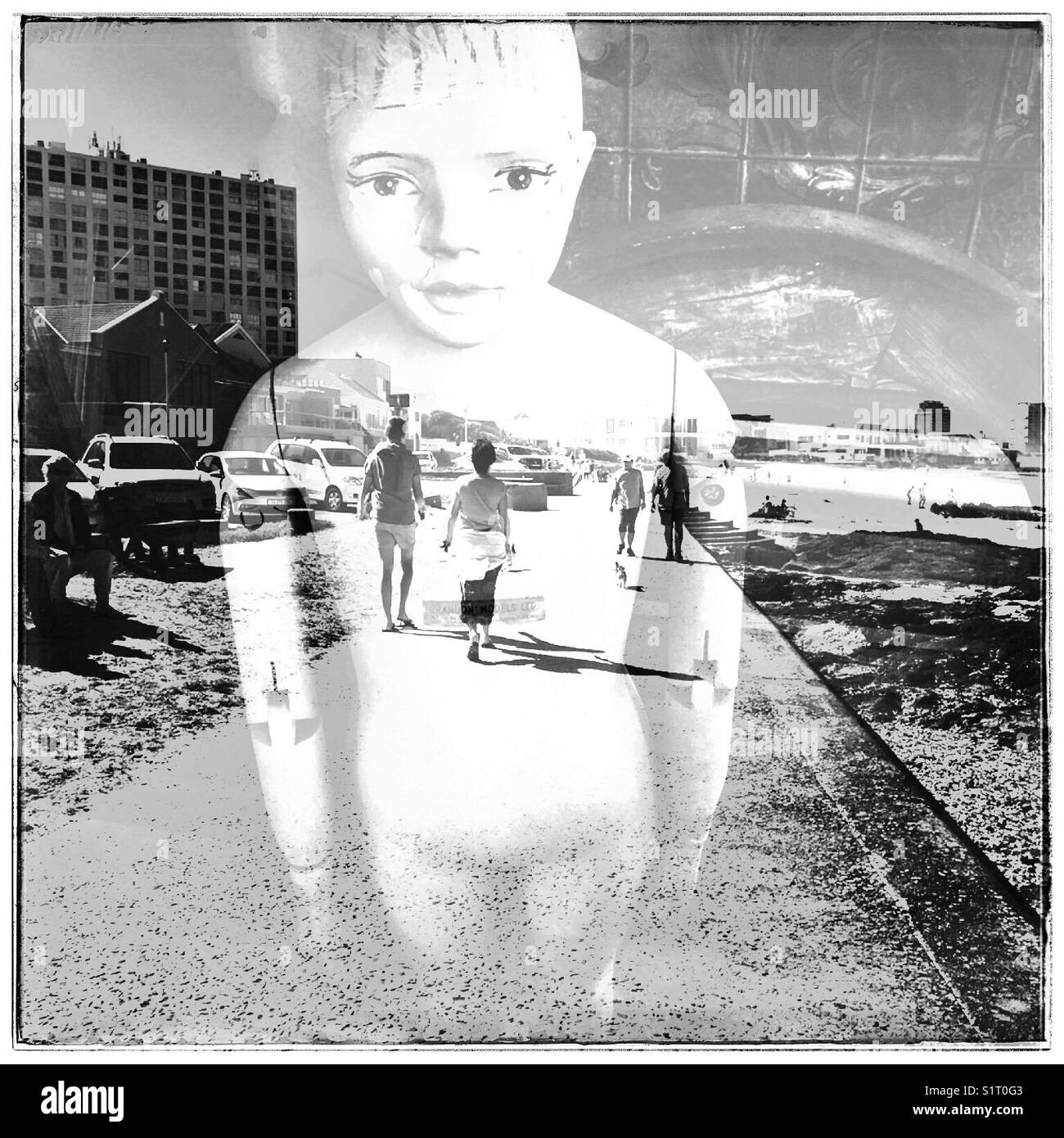 Double exposure of people walking along promenade and Victorian doll. - Smartphone Captured Stock Image