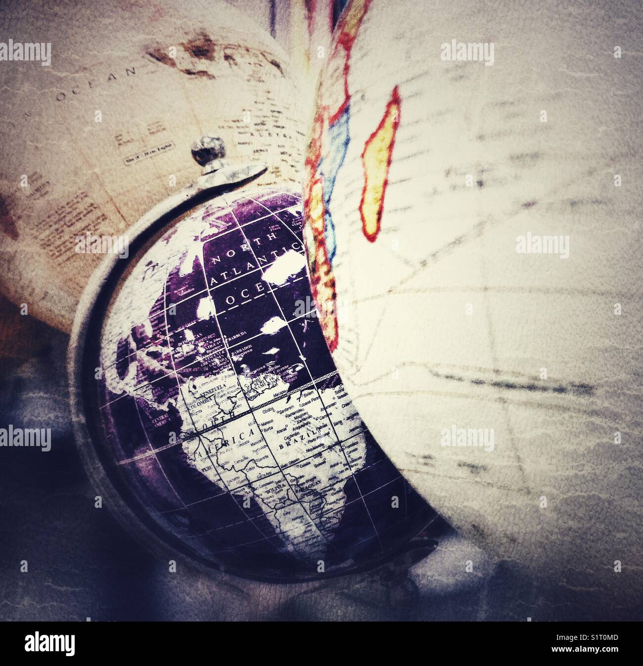 Purple globe on display with vintage style globes in a department store - Smartphone Captured Stock Image Purple globe on display with vintage style globes in a department store - Smartphone Captured Stock Image
