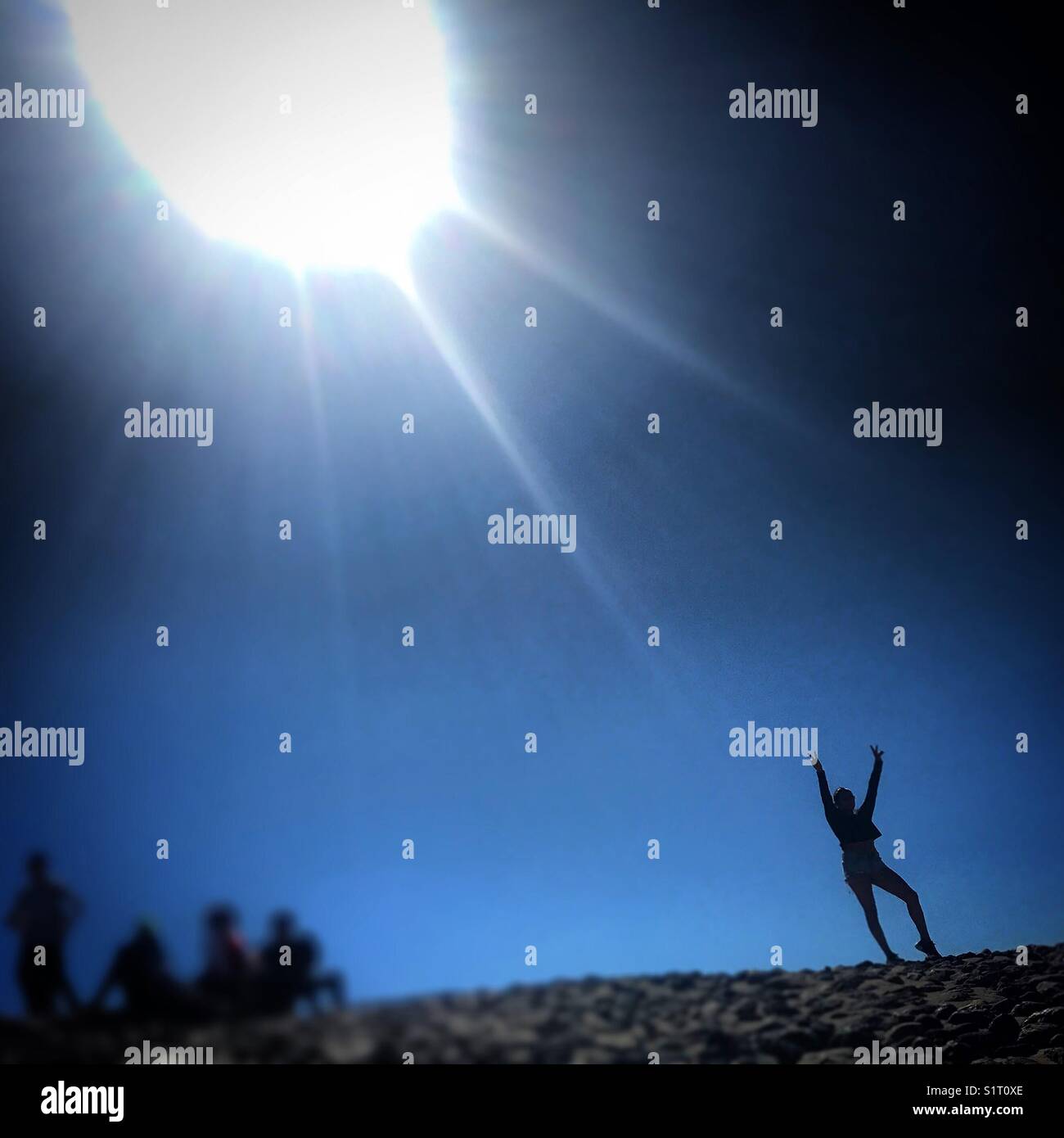 A woman poses for a picture in the pyramid of the sun in Teotihuacan, Mexico City, Mexico. - Smartphone Captured Stock Image