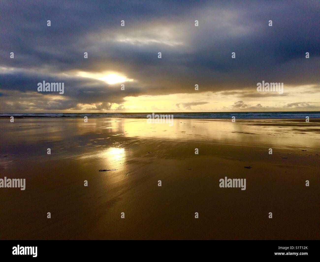Sunset over the sea at Constantine Bay, North Cornwall, UK, on an autumn afternoon. - Smartphone Captured Stock Image