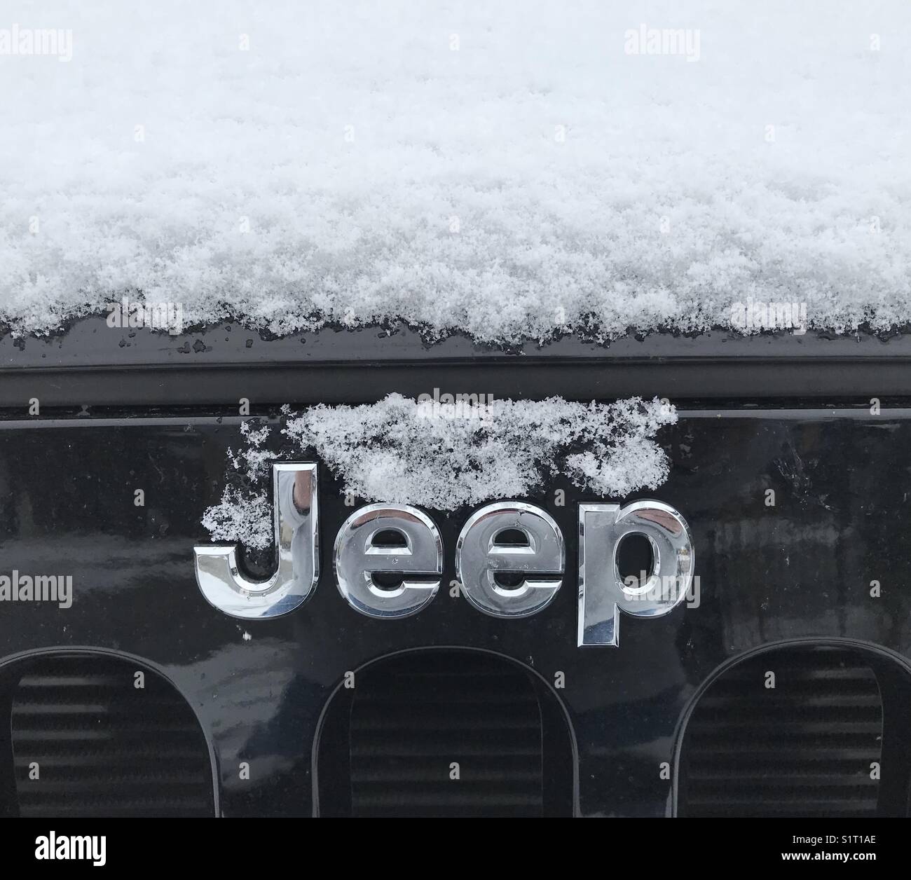 New snow on black Jeep Stock Photo
