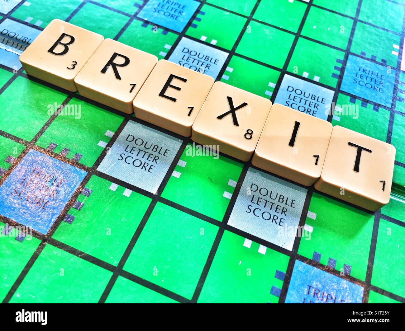 The word Brexit written on the board game Scrabble - Smartphone Captured Stock Image