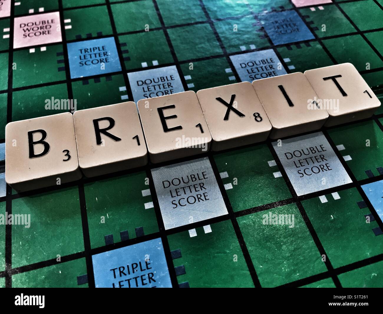 The word Brexit written on the board game Scrabble - Smartphone Captured Stock Image