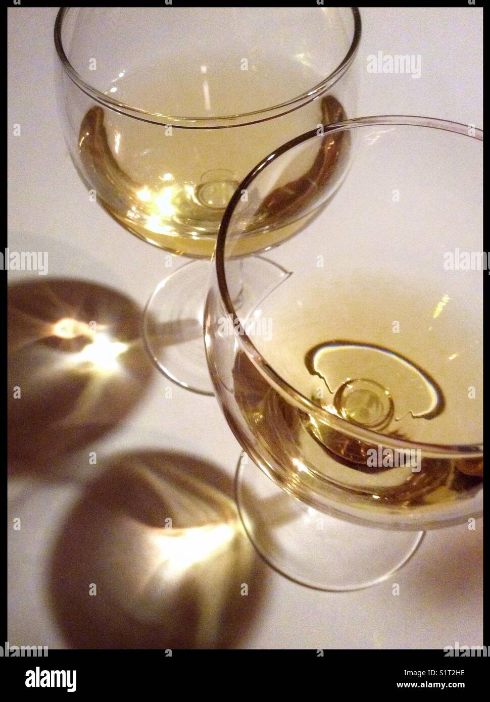 A sample of 'Orange Wine' (front) made from [white] Macabeo grapes fermented on the skins (with its normal counterpart in the glass behind), Catalonia, Spain. - Smartphone Captured Stock Image