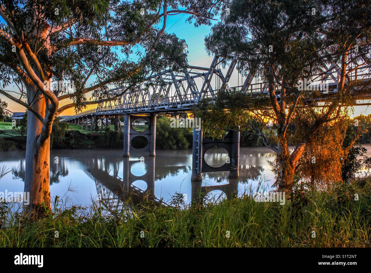 Bridge over river with trees and reflections - Smartphone Captured Stock Image