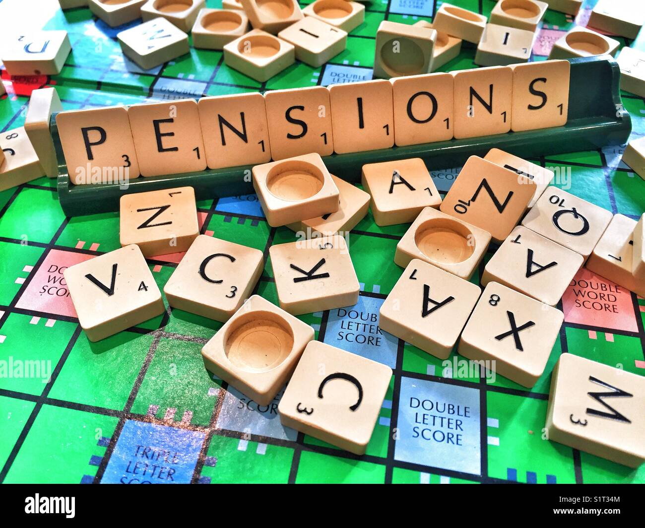 The word pensions written with scrabble tiles Stock Photo