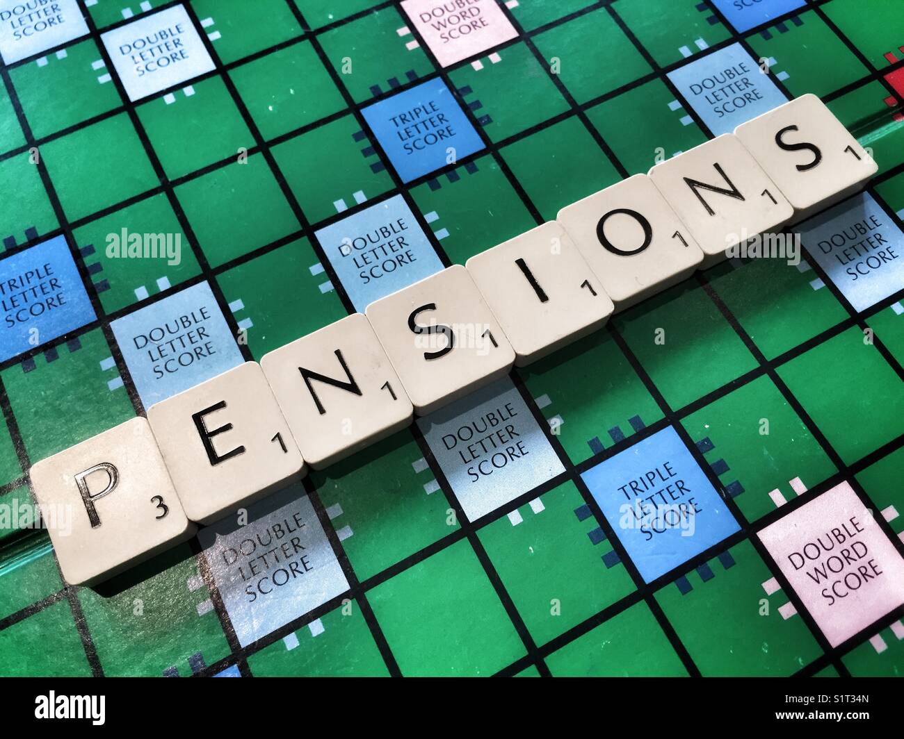 The word pension written with Scrabble tiles Stock Photo