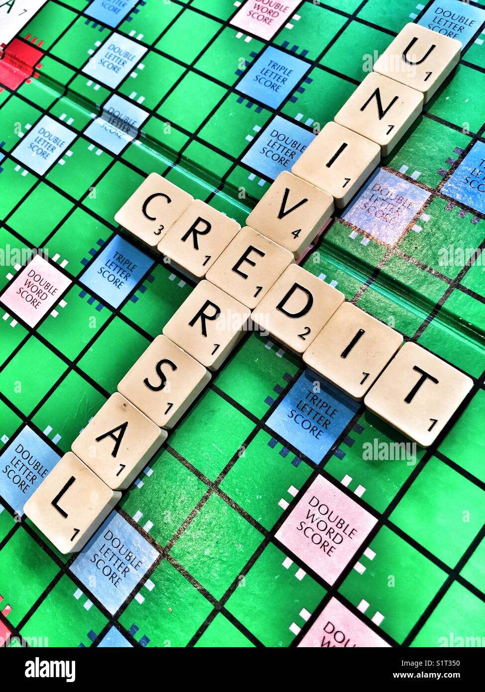 The words Universal Credit written with scrabble tiles Stock Photo